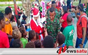 Sambut Natal Satgas Yonmek 521 DY Berbagi Kasih Bersama Warga Merauke