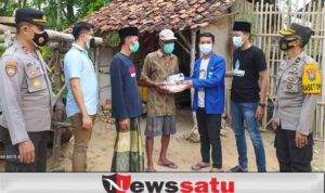 Polres Gandeng PMII Pamekasan Bagikan Bansos dan Masker Kepada Warga Kurang Mampu